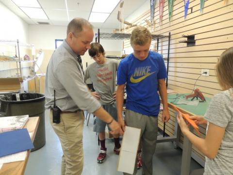 Local middle school students spent Friday afternoon developing shoe models for children dealing with cerebral palsy.
