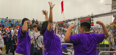 Sunset High School special education teacher Pauline Tatum (middle) cheers along with her students as RoboFlash is announced during the Dallas Regional FIRST Robotics Competition on March 11. Photo: Heather Noel