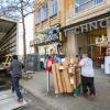 Men unload boxes from a moving truck outside of the Little Rock Technology Park building.